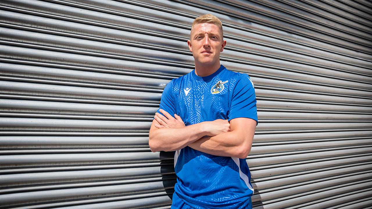 Joel Senior poses after signing his Bristol Rovers contract