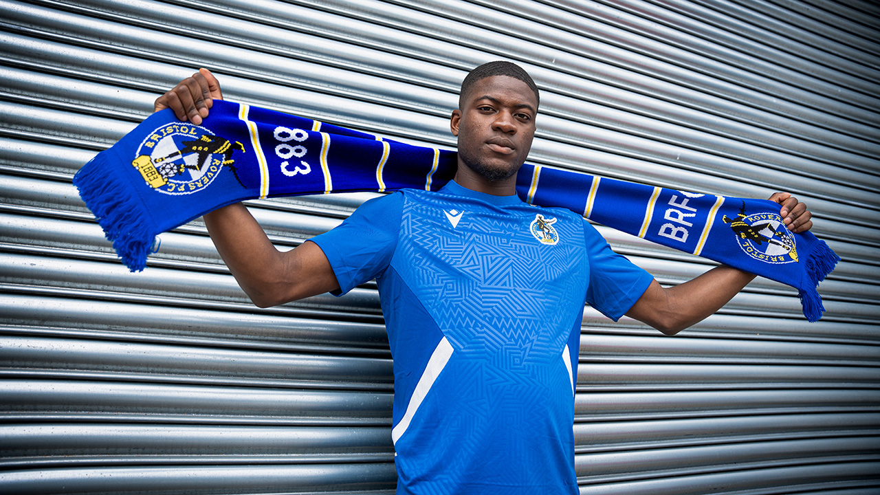 Clinton Mola poses with a Bristol Rovers scarf