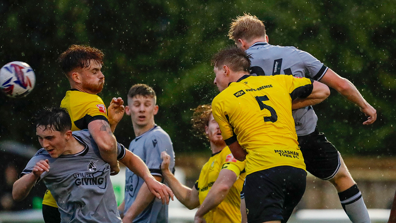 Dan Ellison scores a header in the win over Melksham Town