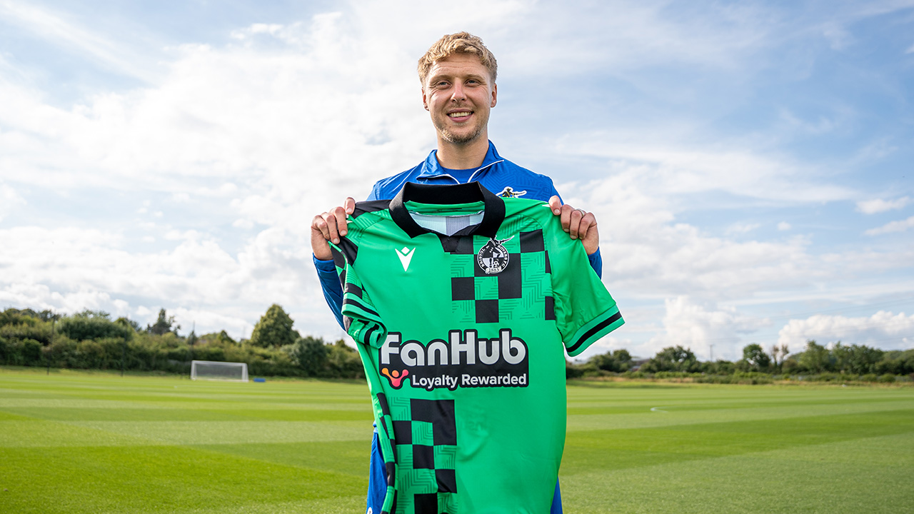 Jamie Lindsay poses with the new away shirt