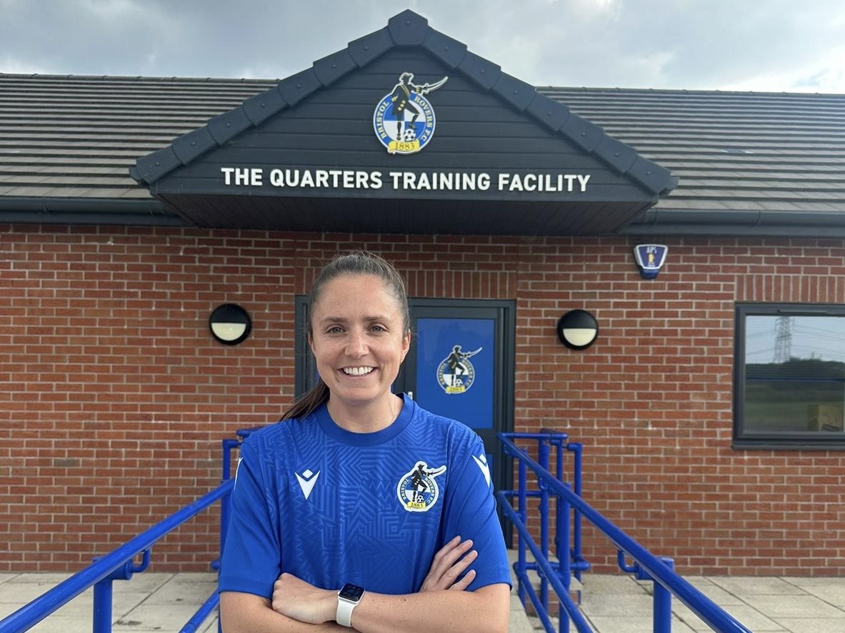 Chloe Bassett standing in front of The Quarters.