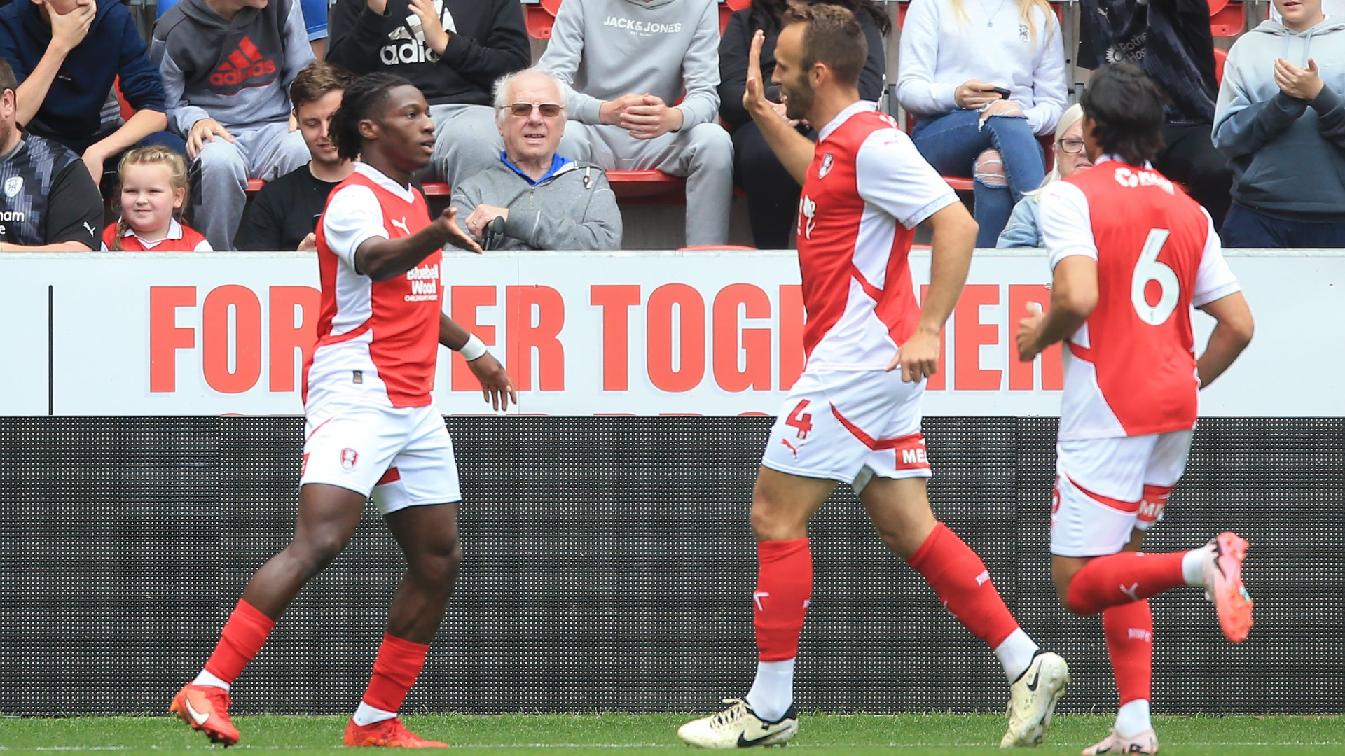 Joe Hungbo of Rotherham United (L) celebrates his goal against Sheffield United with team mates.