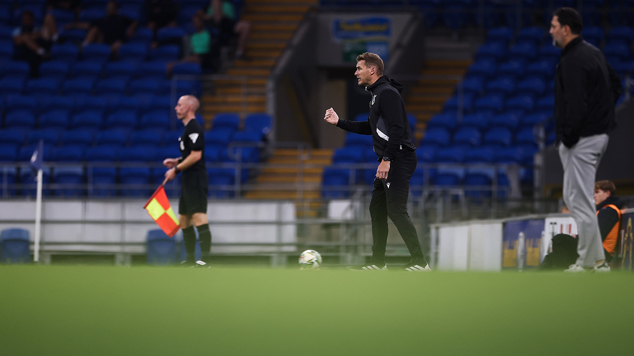 Matt Taylor watches his team against Cardiff City