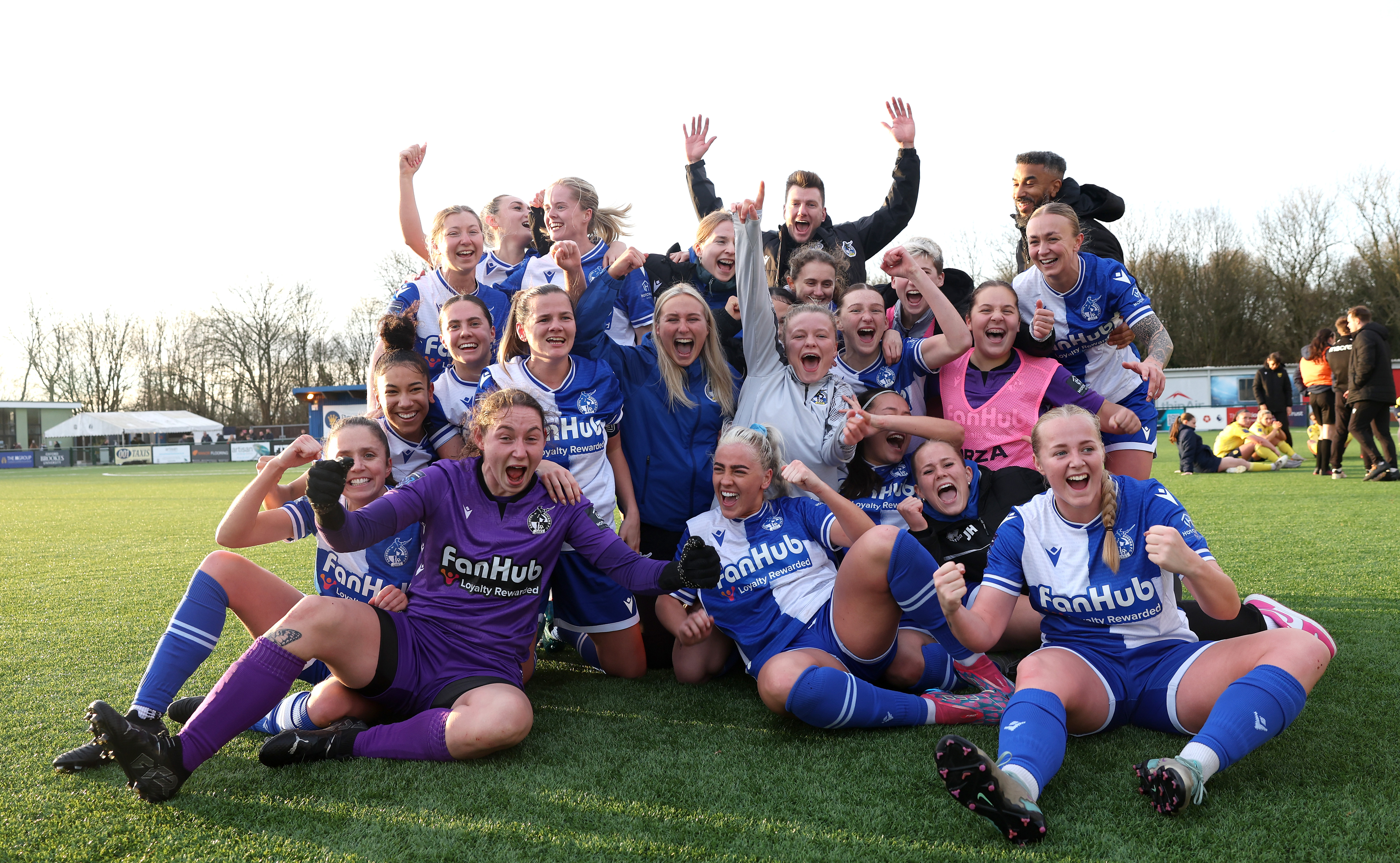 Bristol Rovers Women players and staff celebrate after beating Oxford United.