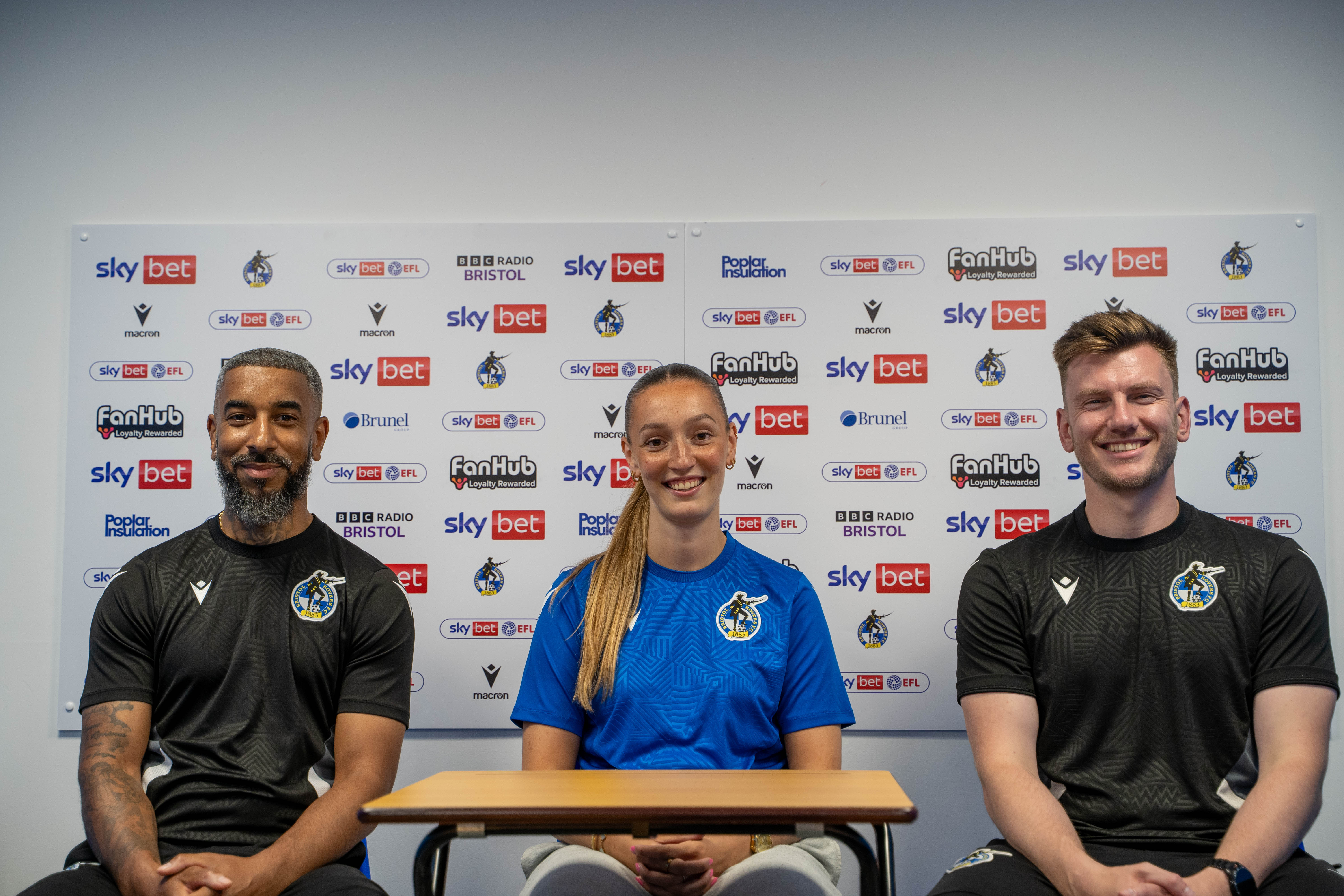 (From Left to Right) Assistant Manager Chris Douglas, Chloe Gilroy and Nathan Hallett-Young seated.