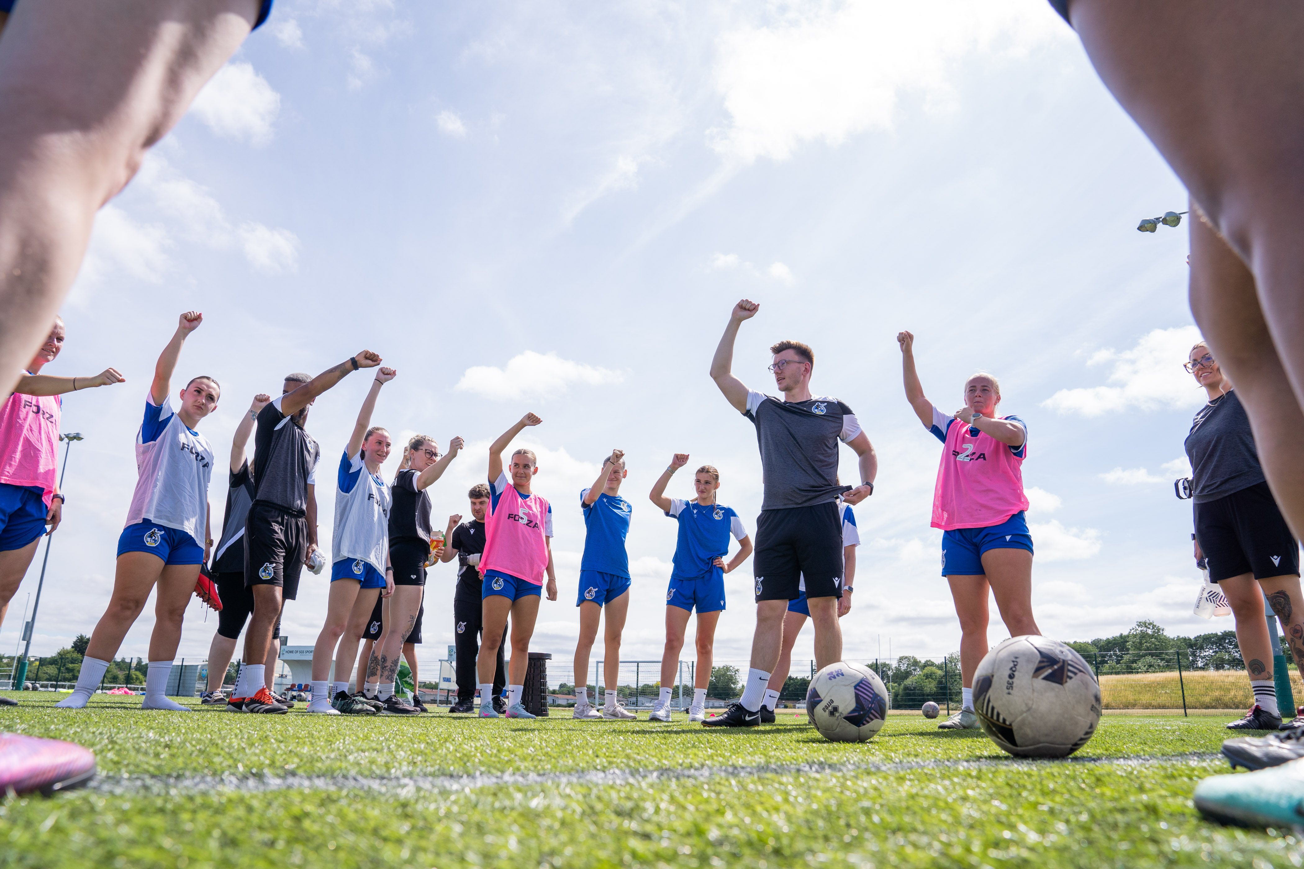 BRWFC players hold their fists up in the air.