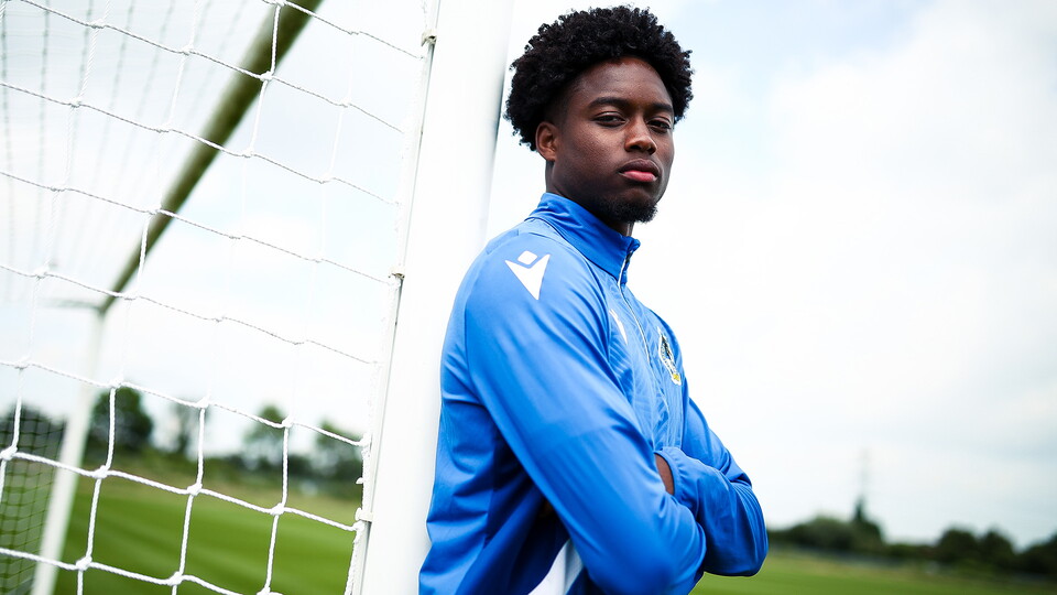 Bryant Bilongo leans against the post