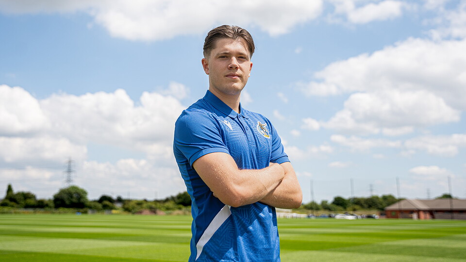 Charlie White poses on the quarters pitch