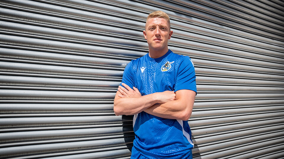 Joel Senior poses after signing his Bristol Rovers contract