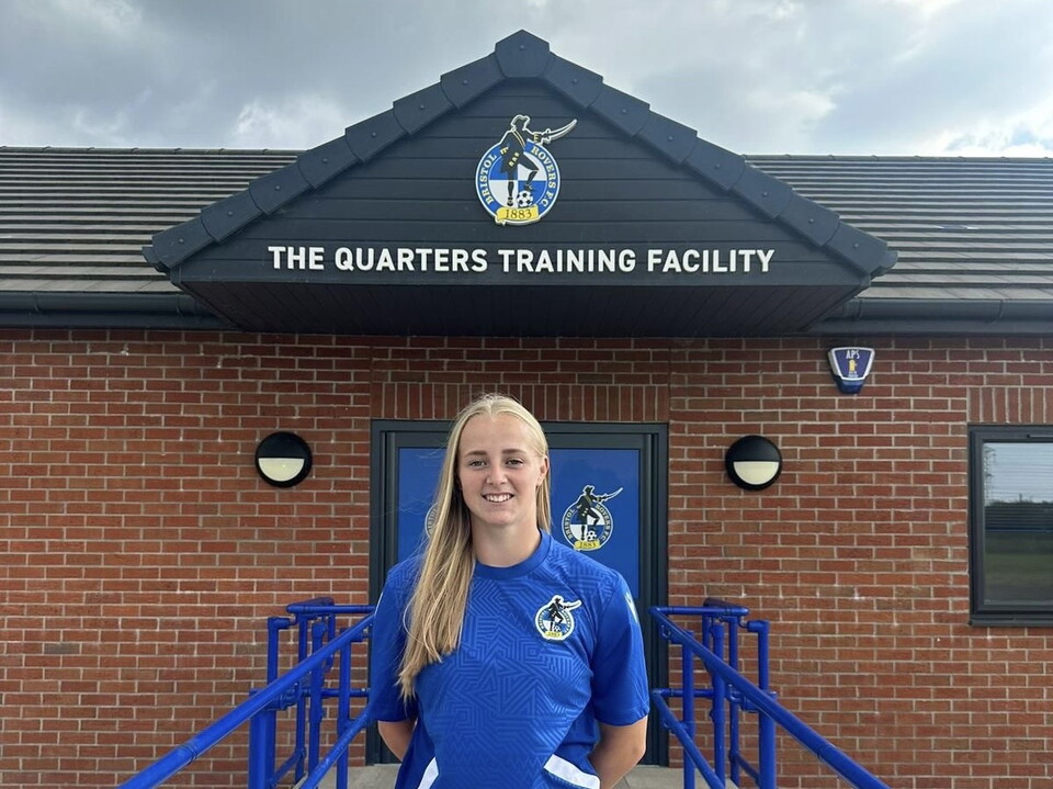 Meg Jarvis standing in front of The Quarters.