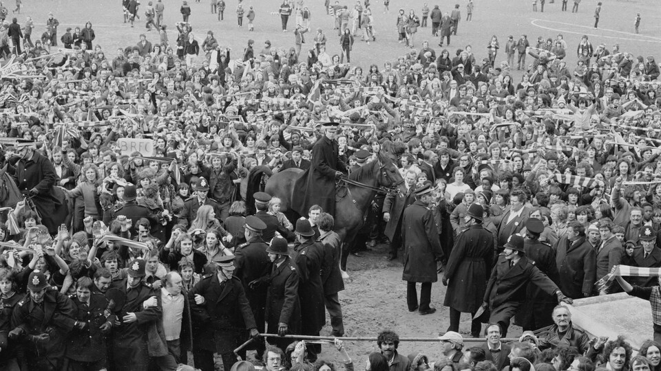 The crowd on the Eastville pitch after the final game of the season against Brighton