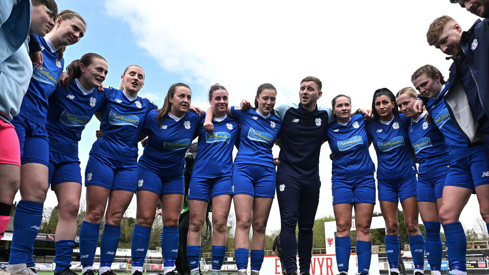 Cardiff City Ladies in a huddle.