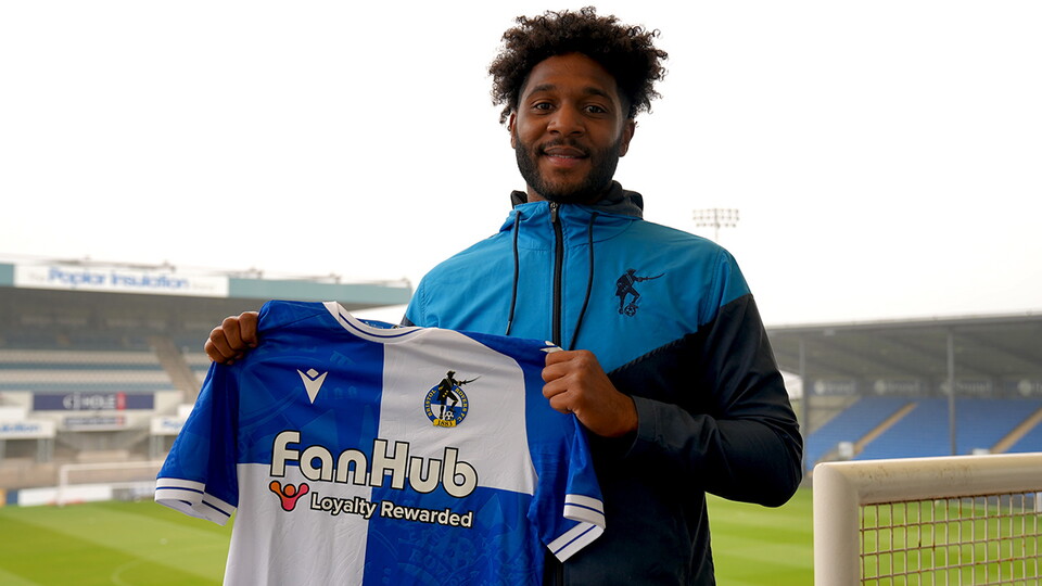 Ellis Harrison poses with a new Bristol Rovers shirt