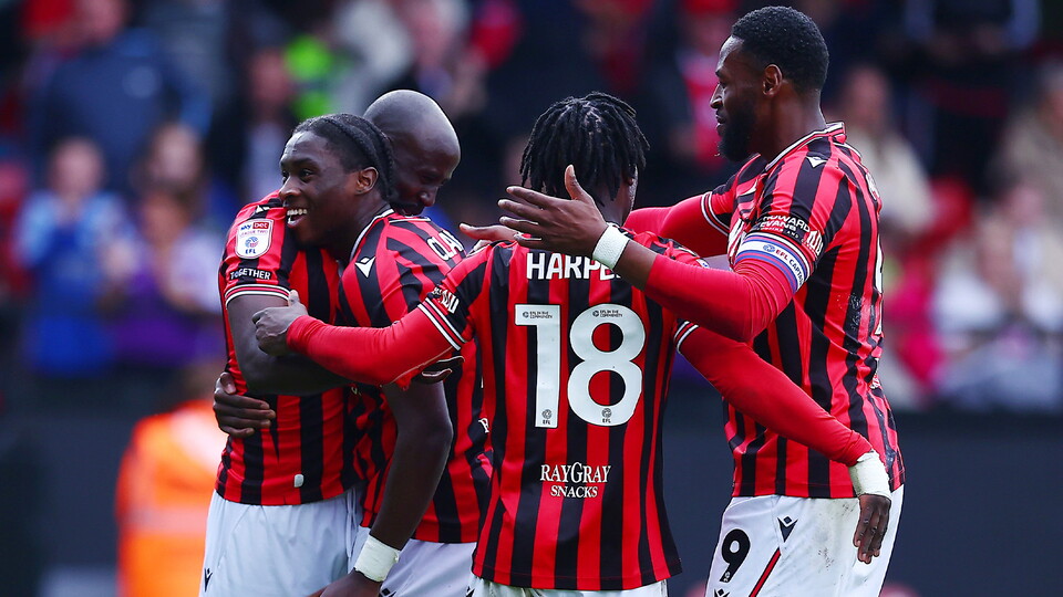 Albert Adomah of Walsall celebrates scoring a goal to make it 4-2