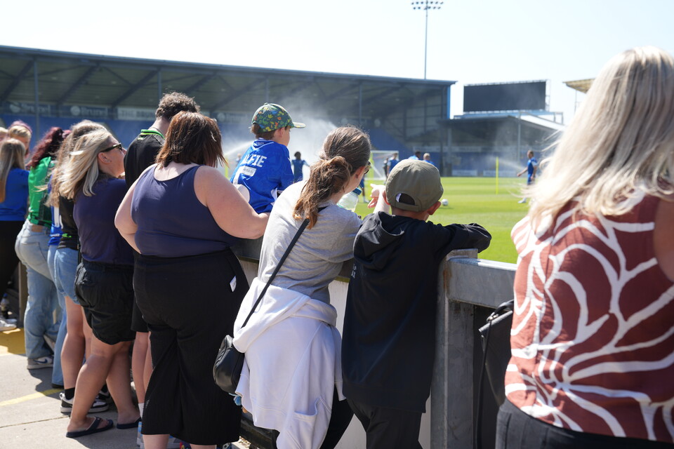 Bristol Rovers supporters looking at pitch