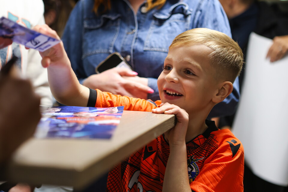 Child at store signing event