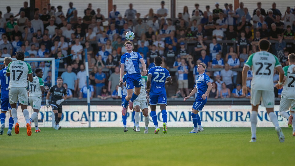 Ryan Howley heads the ball 