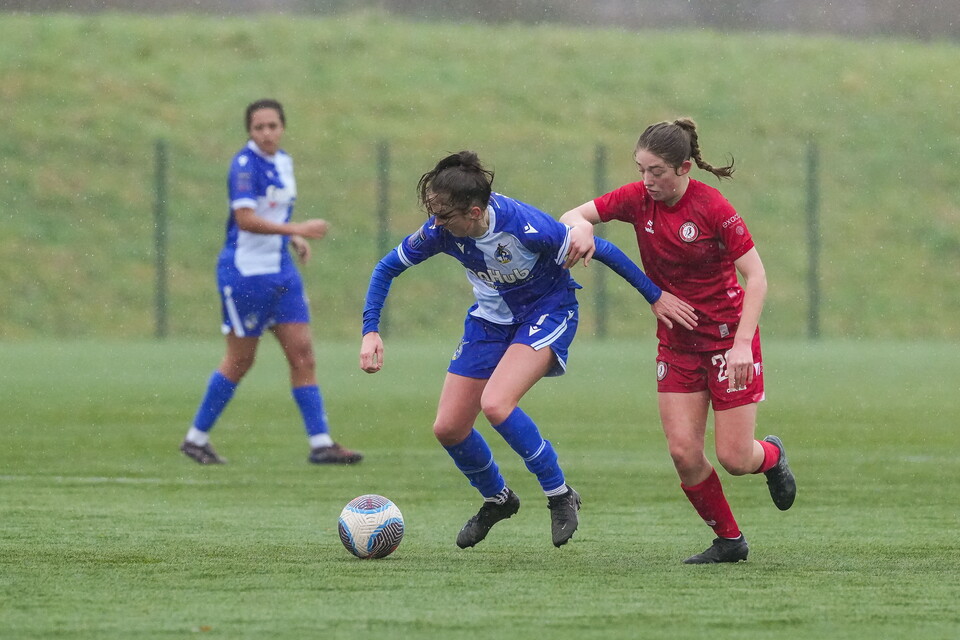 Chloe Bassett holds off a defender.