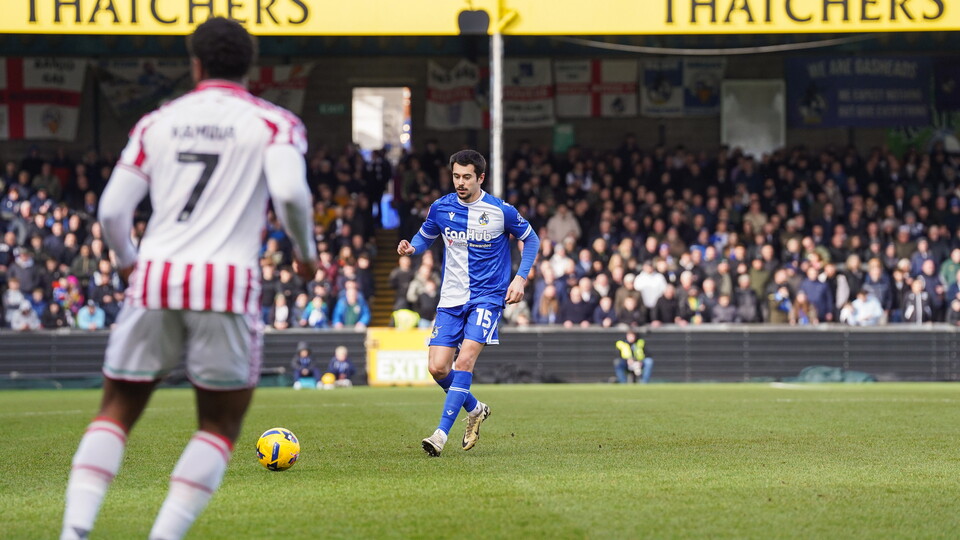 Bristol Rovers player Ryan De Havilland about to kick a ball