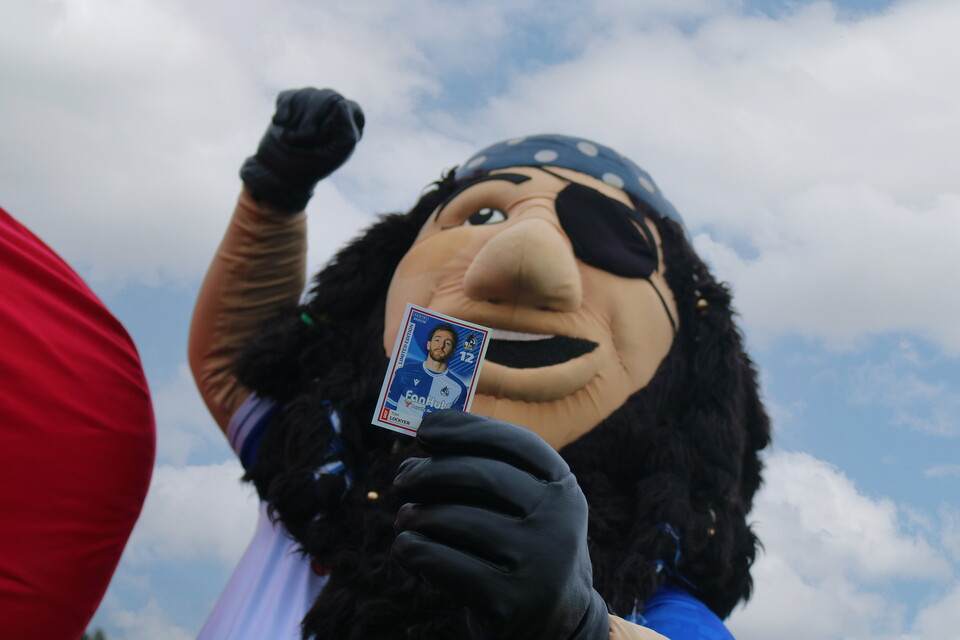 Captain Gas holding Tom Lockyer sticker