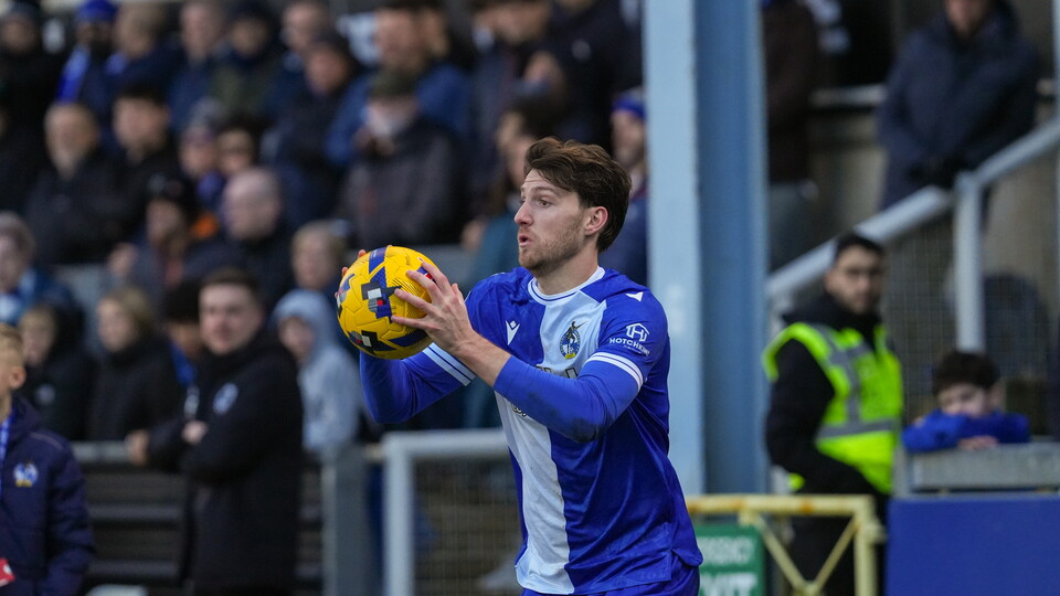 Bristol Rovers player Riley Harbottle doing a throw in