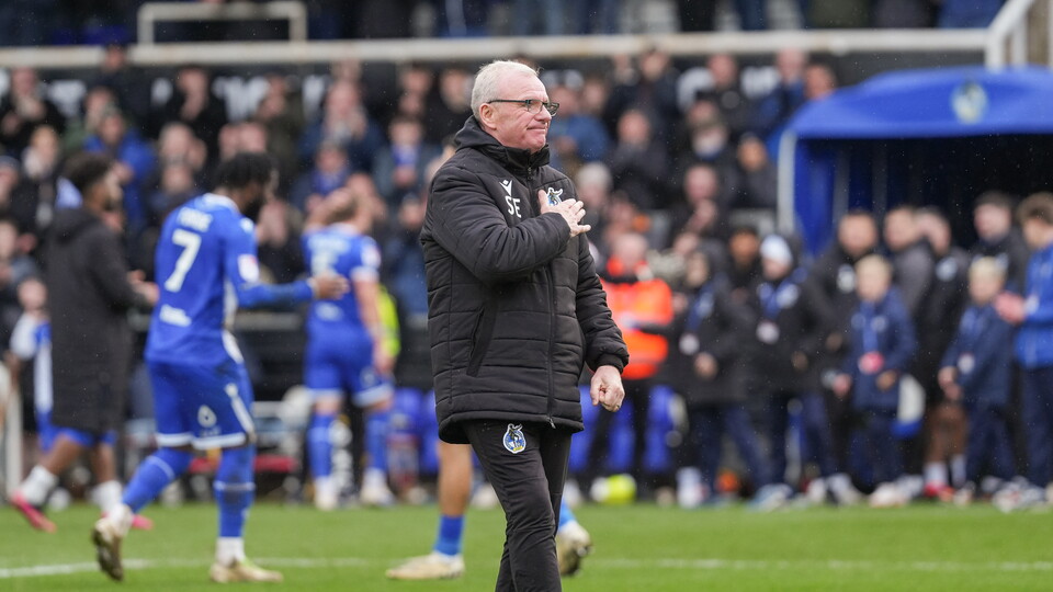 Steve Evans with his hand over his heart