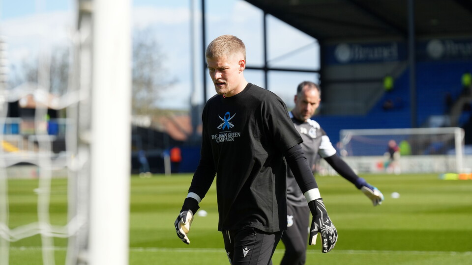 Brad Young warms up before the match