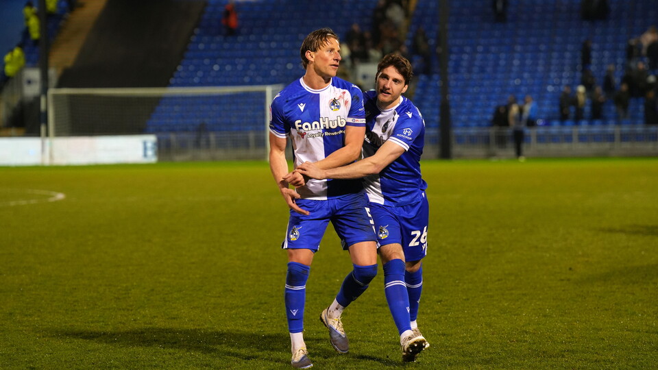 Riley Harbottle celebrating with his arm around Alfie Kilgour after their win