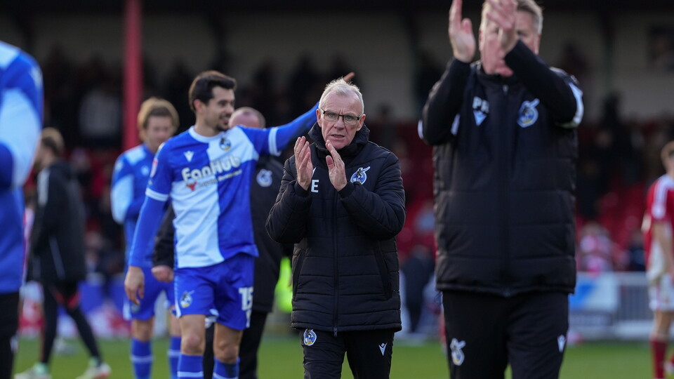 Steve Evans applauds the fans after the Swindon match