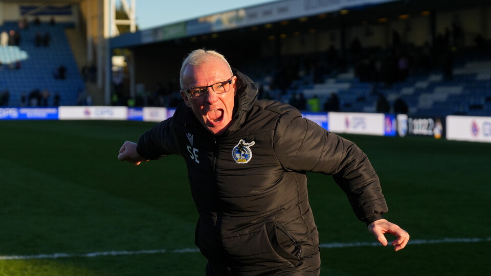 Steve Evans celebrates his team's win over Gillingham 