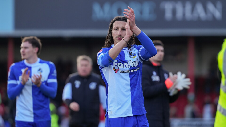 Yusuf Akhamrich applauding after the Swindon match