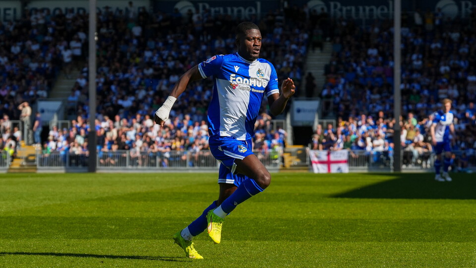 Clinton Mola running during his match against Cheltenham Town