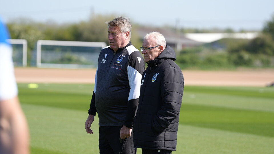 Steve Evans and Paul Raynor watching Bristol Rovers on the training pitch