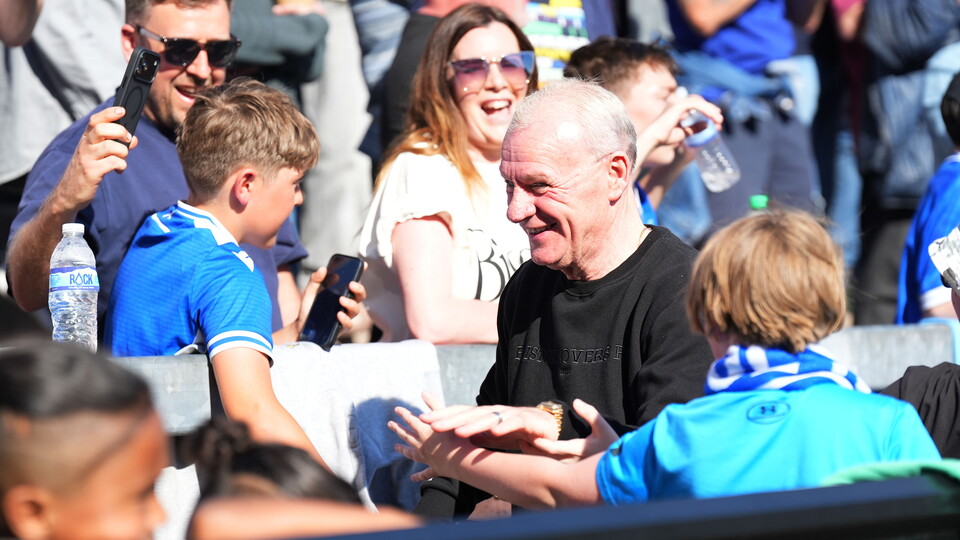 Steve Evans greeting fans in the Thatchers end