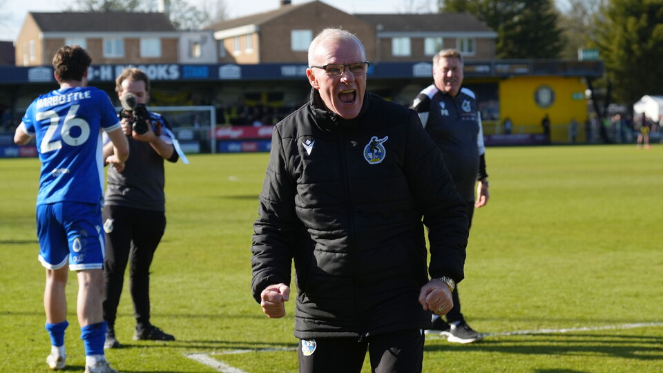 Steve Evans celebrates his team's win over Harrogate Town