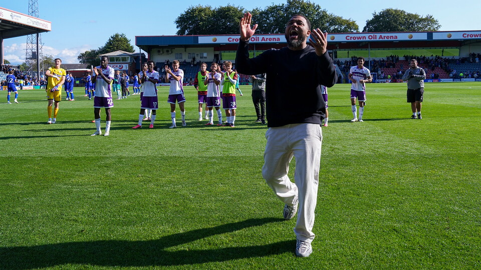 Crawley Town Manager Colin Kazim-Richards celebrates in front of the Crawley Town fans with his players at full-time. Final score Rochdale AFC 1 Crawley Town 2.