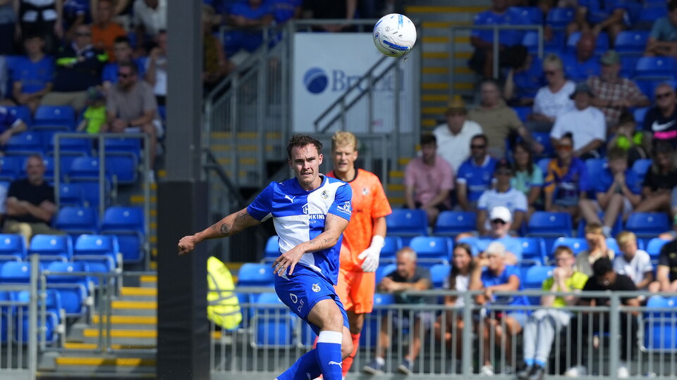 Kofi Balmer performing a long pass
