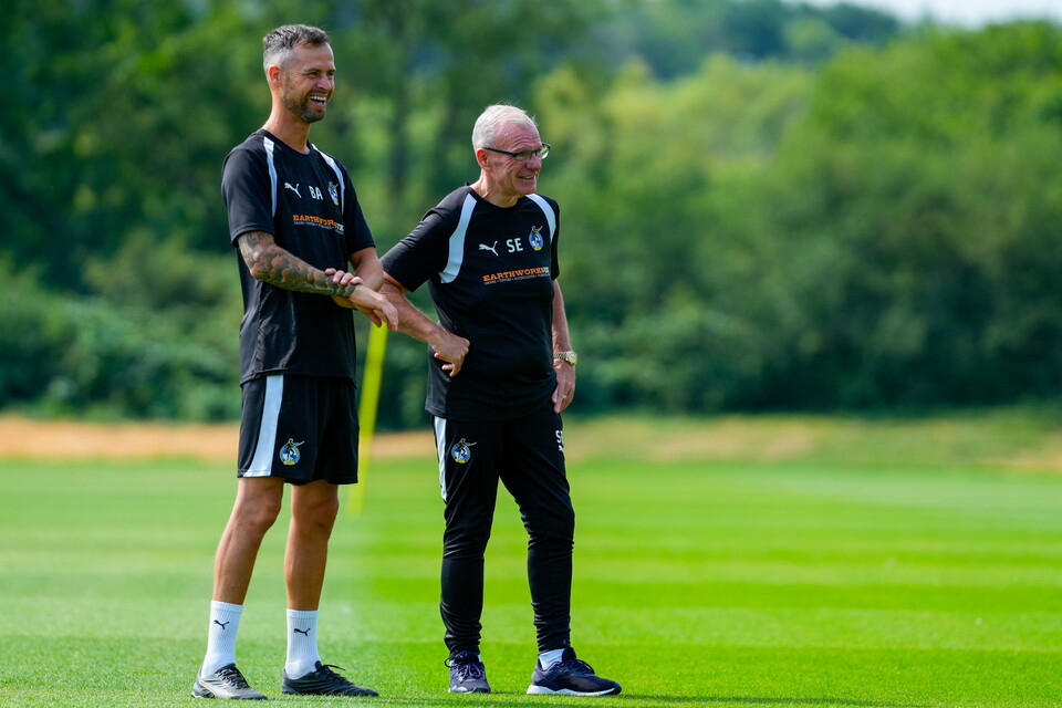 Manager and Coach wearing Earthworks