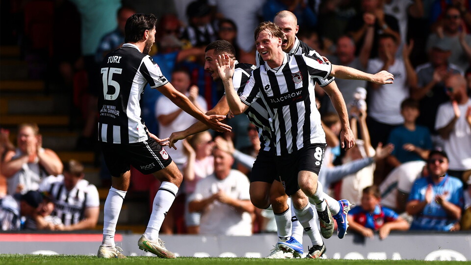 Cian Doyle of Grimsby Town celebrates after Harvey Rogers of Grimsby Town scores his sides first goal of the match