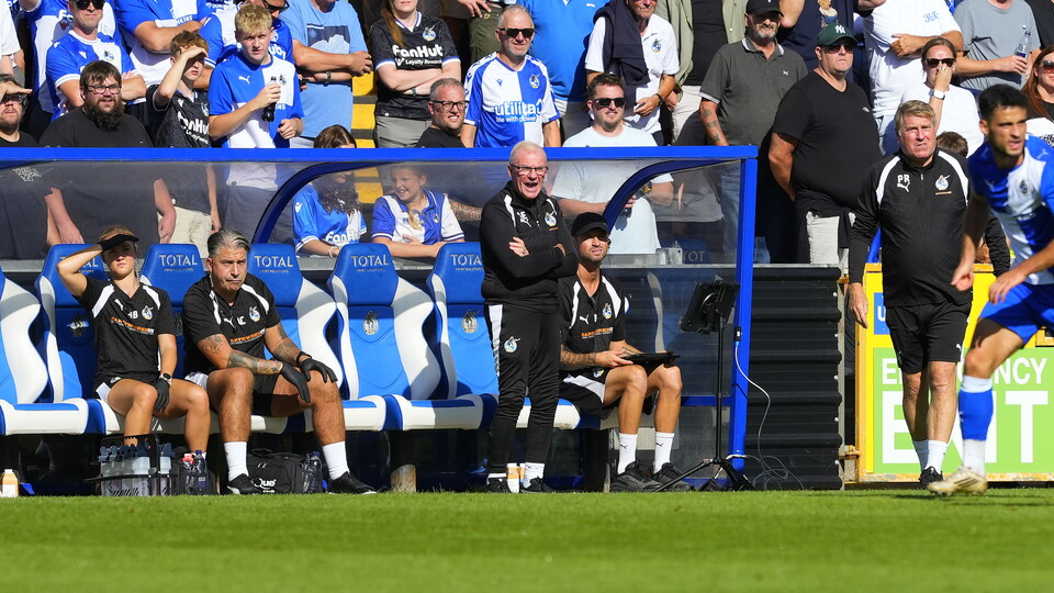 Steve Evans watching Bristol Rovers from the dugout 