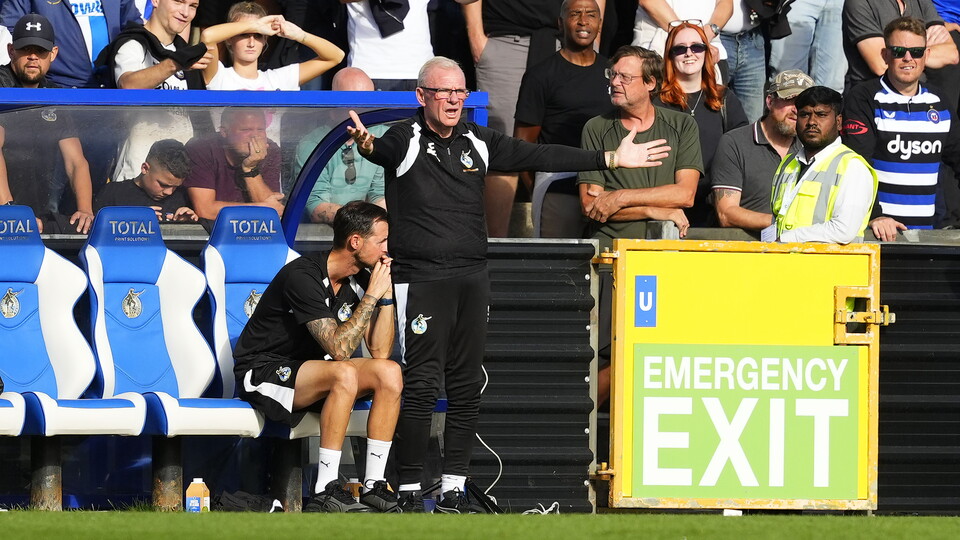 Steve Evans watches his team from the touch line