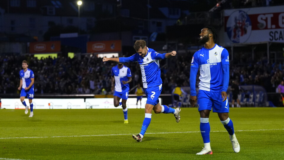 Tom James celebrates his goal with Shaq Forde