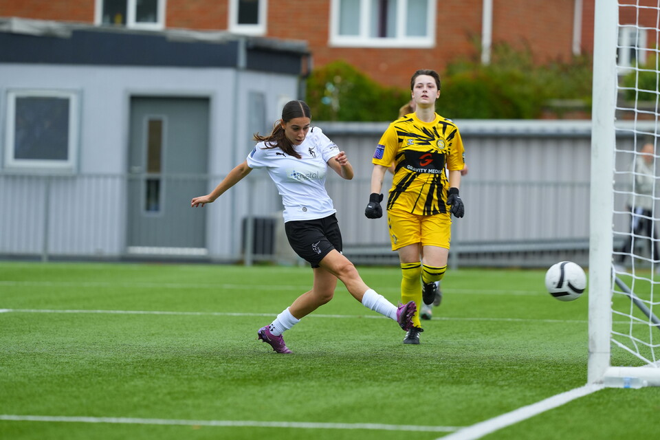 Helena Costa scoring into an open net