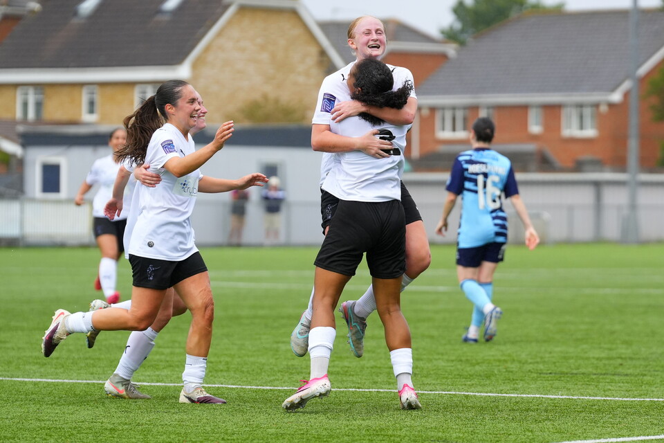 Libby Davies with Layah Douglas and Nia Rees after scoring