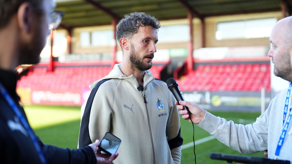 Tom James speaks to the media after the loss against Crewe