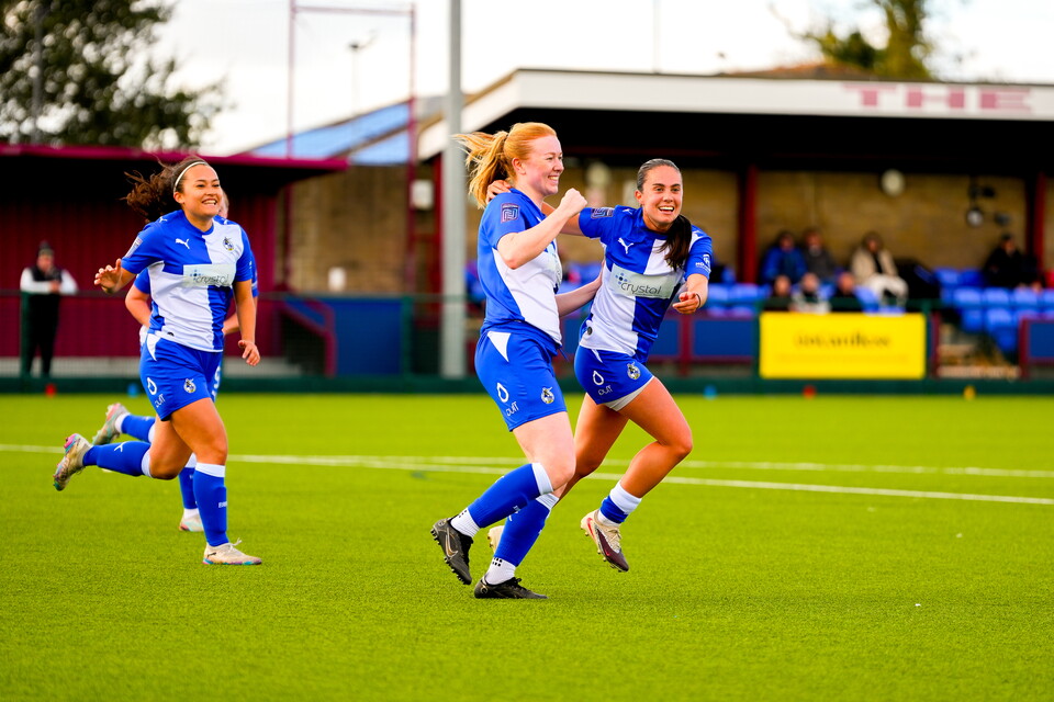 Freya and Nia celebrating a goal.