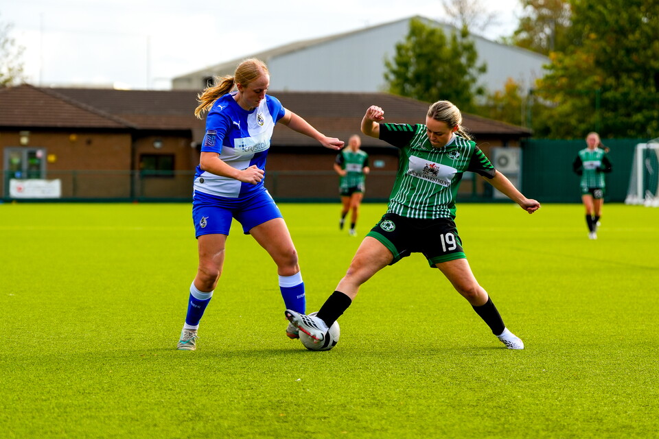 Libby Davies is put under pressure during a tackle by a Keynsham defender.