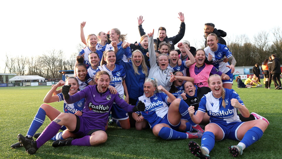 Bristol Rovers Women players and staff celebrate after beating Oxford United.