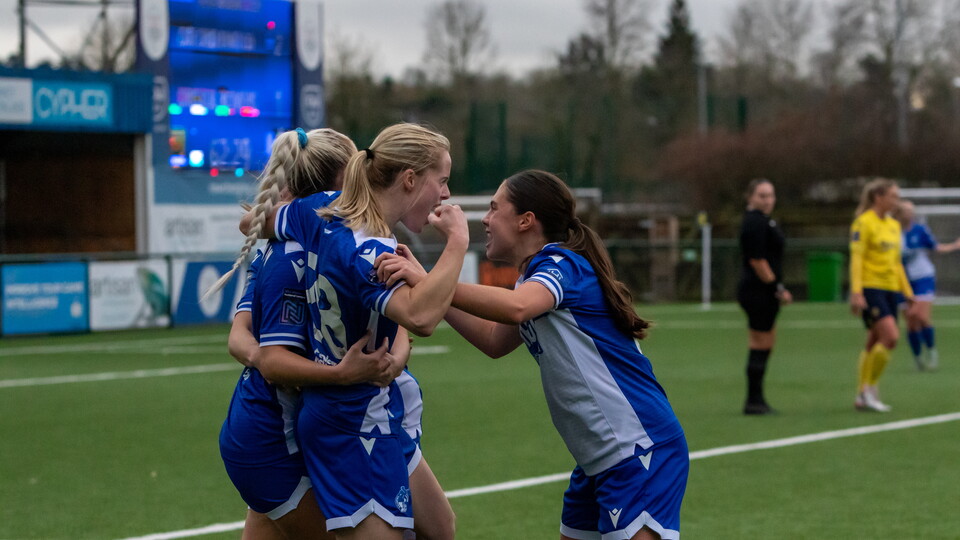 Daisy Ackerman, Nia Rees and Emily Bayliss celebrate together.