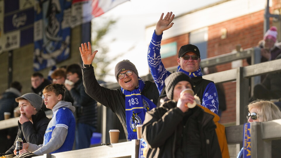 Bristol Rovers fans waving in stand